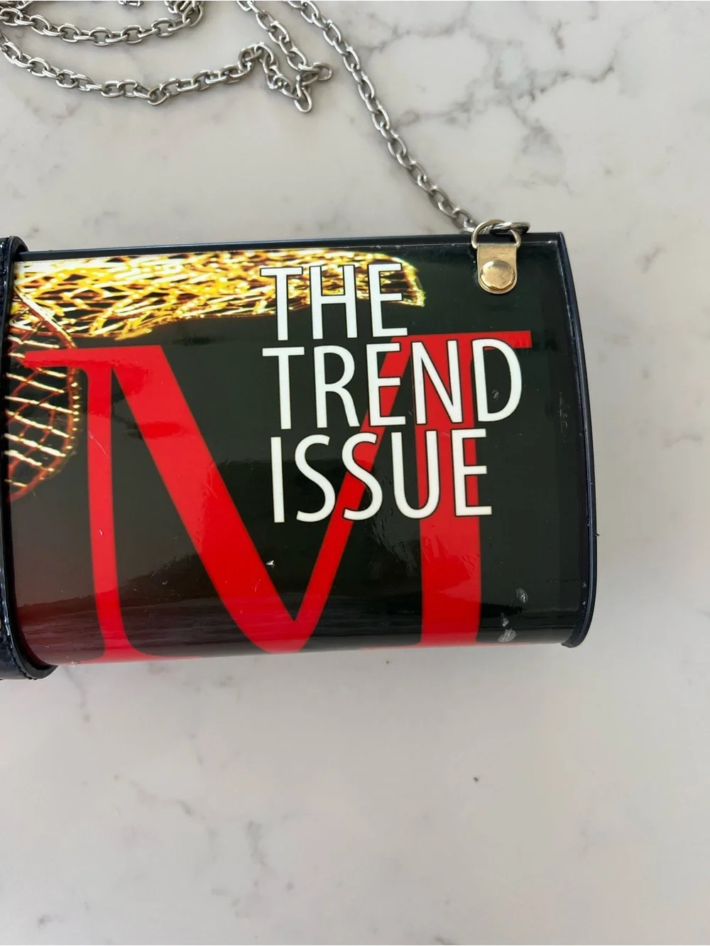 Edgy 80s rolled magazine clutch hard case with crossbody chain red and black